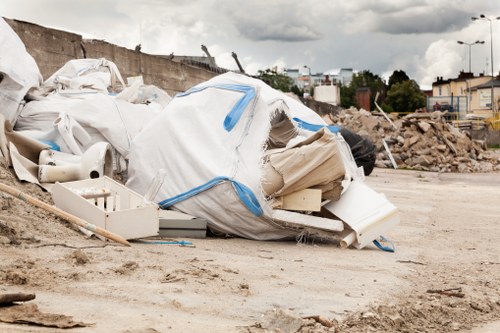 Workers clearing items from a house in East London