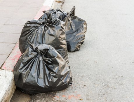 Professional house clearance team sorting belongings